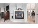 Bright bedroom features a fireplace, sleek television and access to the kitchen at 5271 N Mesa Dr, Castle Rock, CO 80108