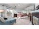 Spacious bedroom features a private balcony, carpet flooring and a sleek fireplace at 5271 N Mesa Dr, Castle Rock, CO 80108