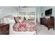 Bright bedroom boasts generous natural light, carpet flooring and mirrored closet doors at 5271 N Mesa Dr, Castle Rock, CO 80108