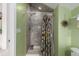 Shower featuring neutral tile and modern shower head at 5271 N Mesa Dr, Castle Rock, CO 80108