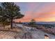 Scenic sunset view showcases the property's serene natural surroundings and expansive views at 5271 N Mesa Dr, Castle Rock, CO 80108