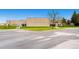 Ken Caryl Ranch Plains Elementary School is set against a blue sky and expansive parking lot at 1183 S Pierson Ct, Denver, CO 80232