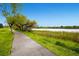 Scenic walking path beside a lake with lush vegetation and a peaceful atmosphere at 1183 S Pierson Ct, Denver, CO 80232