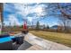 Backyard patio with an outdoor dining set, fire pit, and string lights for evening enjoyment at 209 Falmouth St, Castle Rock, CO 80104