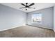 Large bedroom featuring a ceiling fan and a large window at 4935 S Zephyr St, Littleton, CO 80123