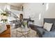 Bright, open living area with soaring ceilings and elegant hardwood flooring at 4935 S Zephyr St, Littleton, CO 80123