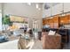 Open living space with hardwood floors, modern furniture, a kitchen island, and natural light at 4935 S Zephyr St, Littleton, CO 80123