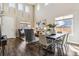 Open living space with high ceilings, hardwood floors, and ample natural light from large windows at 4935 S Zephyr St, Littleton, CO 80123