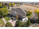 Aerial view of a beautiful home on acreage with professional landscaping at 10044 E 146Th Pl, Brighton, CO 80602