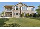 Expansive backyard with lush lawn and outdoor seating area at 10044 E 146Th Pl, Brighton, CO 80602