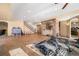 Spacious basement area with workout equipment, bar area, staircase, and tile flooring for versatile use at 10044 E 146Th Pl, Brighton, CO 80602