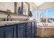 Bright bathroom features dual sinks, vanity, mirrors, and a large soaking tub with a scenic window view at 10044 E 146Th Pl, Brighton, CO 80602