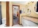 Bathroom features a double vanity and tile floors at 10044 E 146Th Pl, Brighton, CO 80602