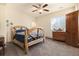 Bedroom with a window, rustic-style bed, and carpeted floor at 10044 E 146Th Pl, Brighton, CO 80602