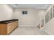 Finished basement area with carpet and a built-in bar with sleek granite countertop at 283 Huntley Ct, Castle Pines, CO 80108