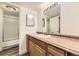 Bathroom with vanity and shower behind sliding glass door at 14720 E Kentucky Dr # 625, Aurora, CO 80012