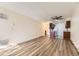 Living room showcasing wood-look flooring and adjoining kitchen area at 14720 E Kentucky Dr # 625, Aurora, CO 80012