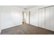 Carpeted bedroom featuring white walls and doorways showcasing floors beyond at 10452 Washington Way, Northglenn, CO 80233