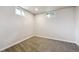 Neutral carpeted bedroom with white walls and two windows providing good natural light at 10452 Washington Way, Northglenn, CO 80233