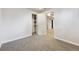 Carpeted bedroom with white walls, closet and open doorway leading to adjacent areas at 10452 Washington Way, Northglenn, CO 80233