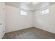 Carpeted bedroom with white walls, two windows and a standard closet door at 10452 Washington Way, Northglenn, CO 80233