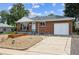 Beautiful brick home with a well-manicured front yard and attached garage at 10452 Washington Way, Northglenn, CO 80233