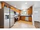 Well-lit kitchen boasts stainless steel appliances and ample cabinet space at 10452 Washington Way, Northglenn, CO 80233