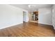 Open-concept living area with hardwood floors and a view into the kitchen at 10452 Washington Way, Northglenn, CO 80233