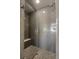 Updated walk-in shower featuring decorative tile and a built-in bench at 1815 Grove St, Denver, CO 80204