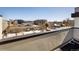 Enjoy city views from this balcony, with a glimpse of snow-covered rooftops and the skyline beyond at 1815 Grove St, Denver, CO 80204