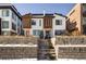 Charming home with a stylish facade, complemented by a stone walkway and manicured landscaping at 1815 Grove St, Denver, CO 80204