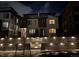 Charming home with a stylish facade illuminated at night, complemented by a stone walkway at 1815 Grove St, Denver, CO 80204