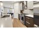 Sleek kitchen featuring modern appliances, stone countertops, and eat-in dining area at 1815 Grove St, Denver, CO 80204