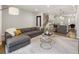 Bright, open living room featuring hardwood floors, modern furnishings, and natural light at 1815 Grove St, Denver, CO 80204