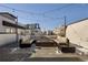 Inviting rooftop deck with modern seating, a fire pit, string lights, and views of the surrounding neighborhood at 1815 Grove St, Denver, CO 80204