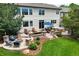 Beautiful backyard with patio, fire pit, and lush landscaping perfect for outdoor living at 6095 S Oswego St, Greenwood Village, CO 80111