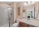 Bathroom featuring a glass shower, tile flooring, and bright lighting at 6095 S Oswego St, Greenwood Village, CO 80111