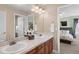 Bathroom featuring double sinks and decorative tile work at 6095 S Oswego St, Greenwood Village, CO 80111
