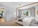 Bright bedroom with neutral walls, natural light, and view of the outdoors at 6095 S Oswego St, Greenwood Village, CO 80111