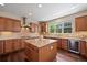 Spacious kitchen with granite countertops, stainless steel appliances, and custom cabinetry at 6095 S Oswego St, Greenwood Village, CO 80111