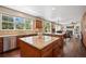 Bright and open kitchen with granite countertops, stainless steel appliances, and a view into the living room at 6095 S Oswego St, Greenwood Village, CO 80111
