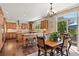 Eat in kitchen boasts stainless appliances, wood floors, center island, and backyard access at 6095 S Oswego St, Greenwood Village, CO 80111