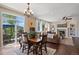 Inviting living room with a cozy fireplace, hardwood floors, and access to the outdoor patio at 6095 S Oswego St, Greenwood Village, CO 80111