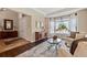 Inviting living room with hardwood floors, large bay window, and stylish decor at 6095 S Oswego St, Greenwood Village, CO 80111