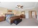 Spacious main bedroom with a tray ceiling, a king-size bed, and carpeted floors at 6095 S Oswego St, Greenwood Village, CO 80111