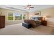 Bright main bedroom featuring large windows with natural light and a seating area at 6095 S Oswego St, Greenwood Village, CO 80111