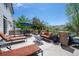 Outdoor patio with furniture, grill, and blue umbrella at 6095 S Oswego St, Greenwood Village, CO 80111