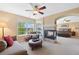 Sitting area with a fireplace between the bedroom and sitting area, and large windows at 6095 S Oswego St, Greenwood Village, CO 80111