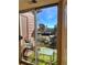 Cozy balcony area with artificial turf, metal railing, seating, and scenic outdoor views through a sliding glass door at 4899 S Dudley St # K18, Littleton, CO 80123