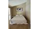 Bright bedroom features a comfortable bed, world map wall art and sunny windows at 4899 S Dudley St # K18, Littleton, CO 80123